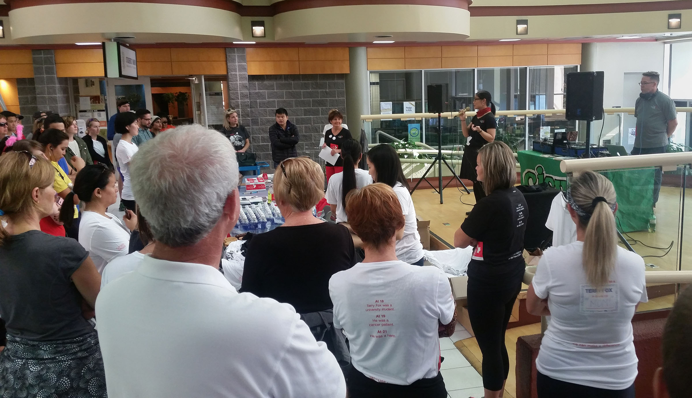 Listening to the opening speeches, which included a UofC researcher and a UofC student who is a cancer survivor.